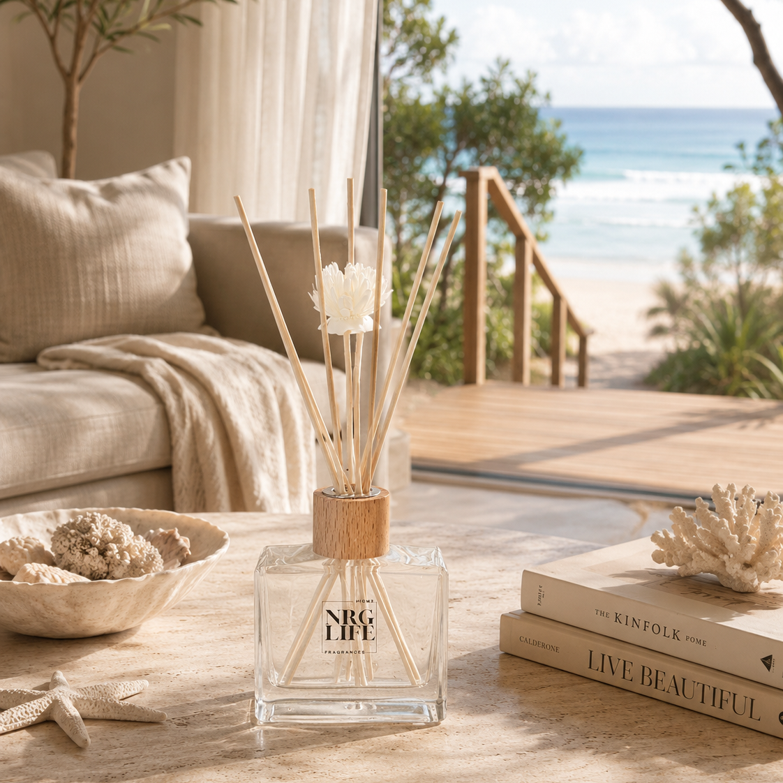Decorative Bondi Breeze Reed Diffuser on a table with ocean view.