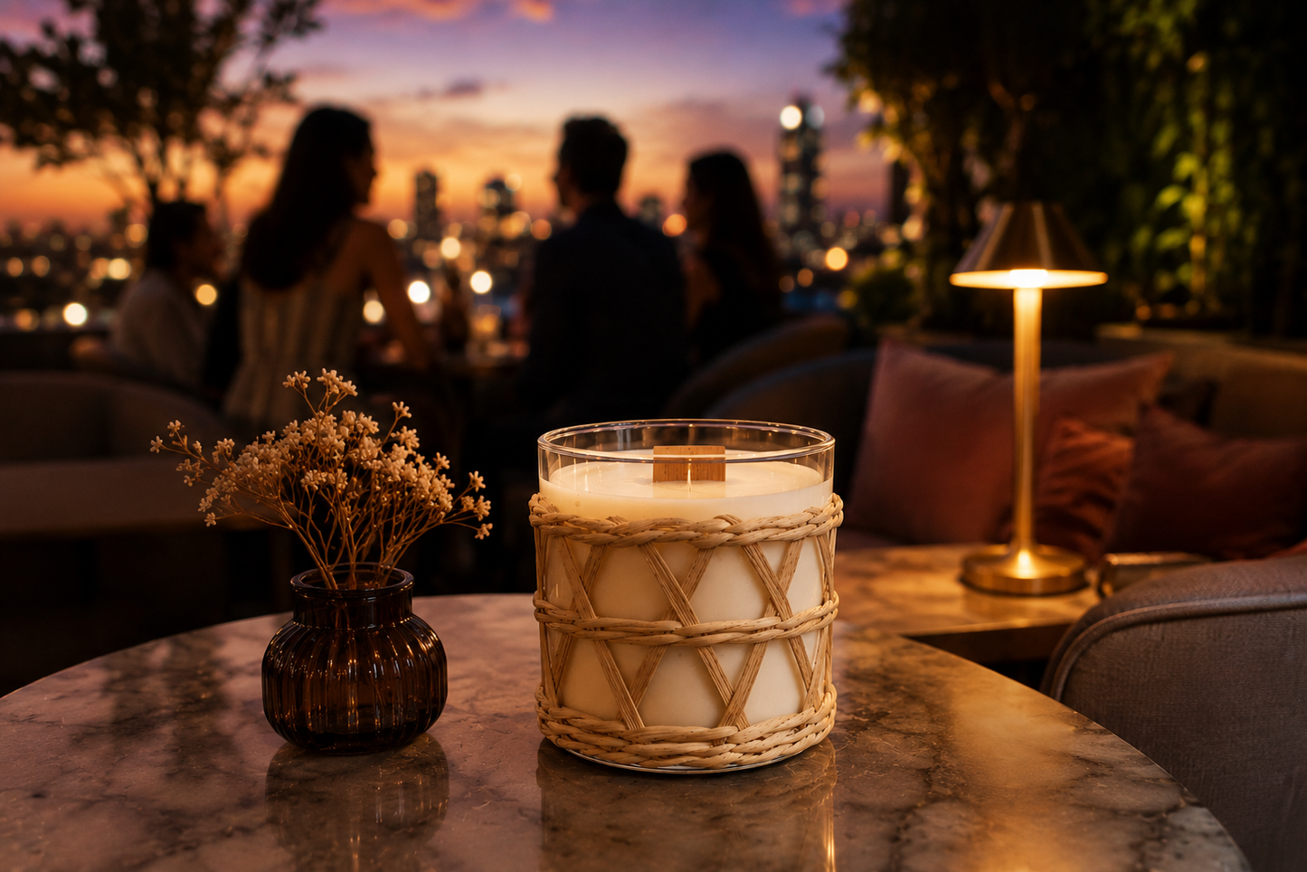 A candle called Espresso Martini in a decorative rattan weave overlay on a table with a cityscape in the background