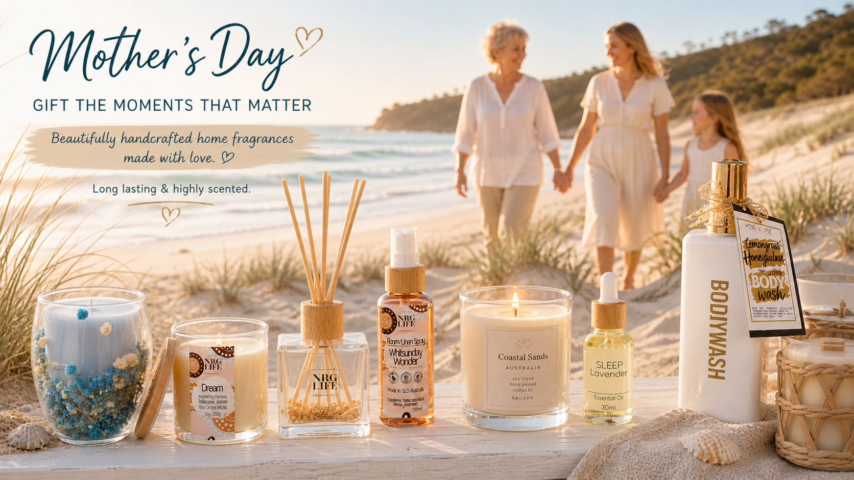 Home fragrance products on a beach with a family in the background, celebrating Mother's Day.