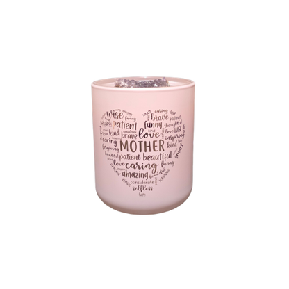 Pink Mothers Day Candle with text in a heart shape circle on a pink background