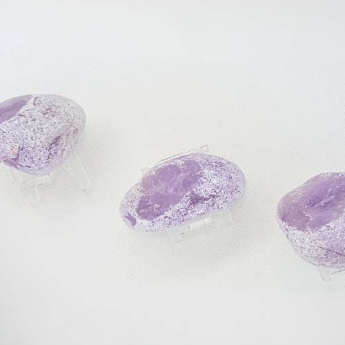 Set of Three Amethyst Emma Stone on a clear Perspex Stand to showcae it.