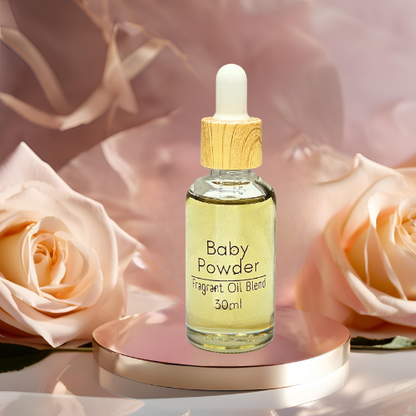 Diffuser bottle of 'Baby Powder' fragrance oil blend with roses in the background for water vapour diffuser.