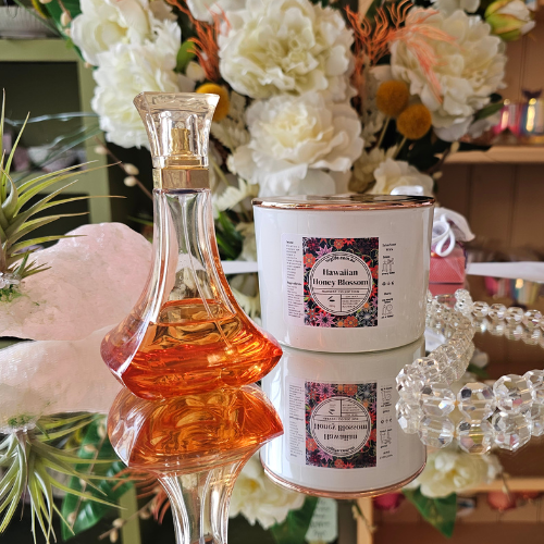 Our Large White Candle infused with Hawaiian Honey Blossom Fragrance featured with a Rose Gold Lid.