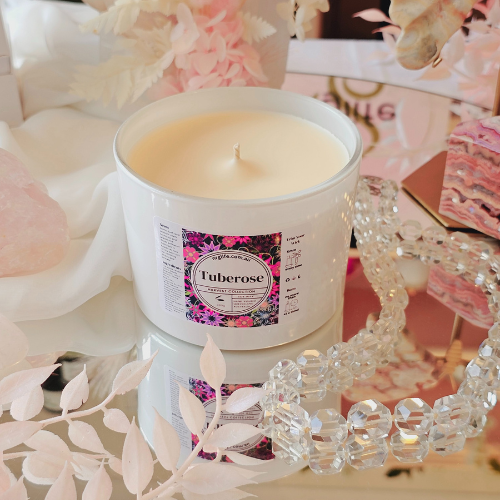 A large white candle infused with our floral fragrance Tuberose, featured without the accompanying Rose Gold Lid.