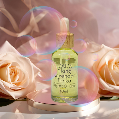Diffuser Oil Bottle of Calm Ylang Lavender Tonka fragrant oil blend with roses and bubbles in the background.