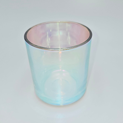 This is a glass candle jar with iridescent or ironplate  accents.