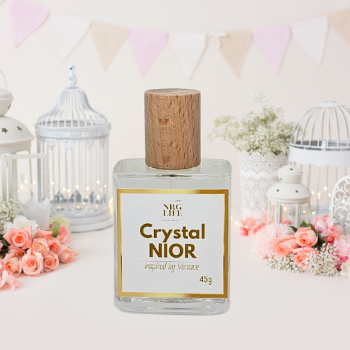 Crystal Noir Dupe perfume bottle with wooden cap on a decorative background with flowers and lanterns