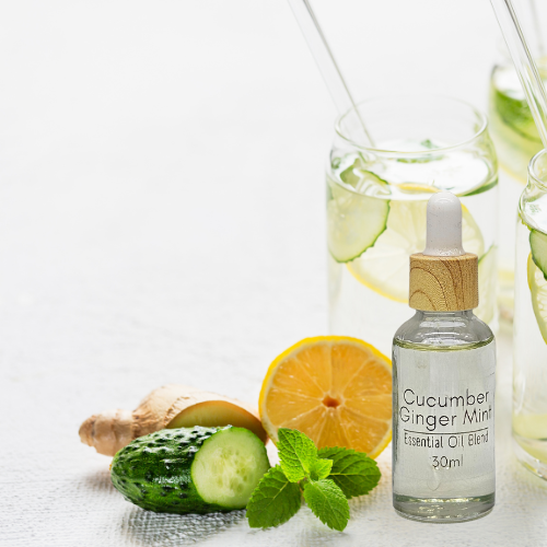30ml Diffuser Cucumber Ginger Mint 'Essential Oil bottle with decorative ingredients on a white background.