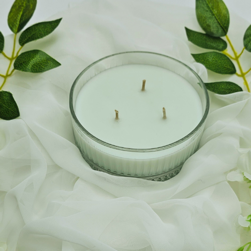 A large flat scented candle with Coconut Lime fragrance.