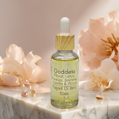 30ml Diffuser Bottle of 'Goddess' fragrant oil blend sitting on a marble table with flowers and crystals in the background.