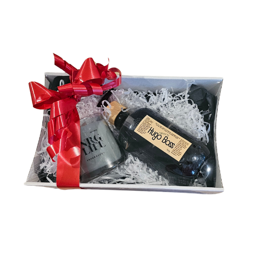 A Gift set of a Mens Coconut Body Wash with a cologne type scent Hugo Boss with a matching candle.