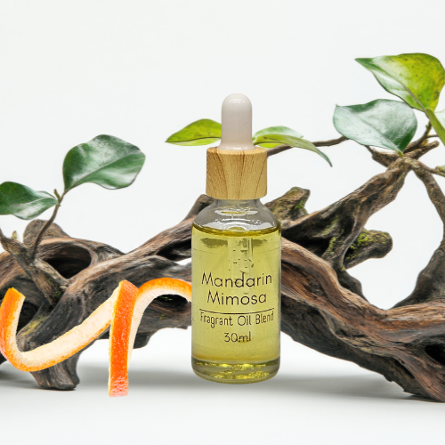 30ml Bottle of Mandarin Mimosa fragrant diffuser oil blend with a dropper on a natural background.