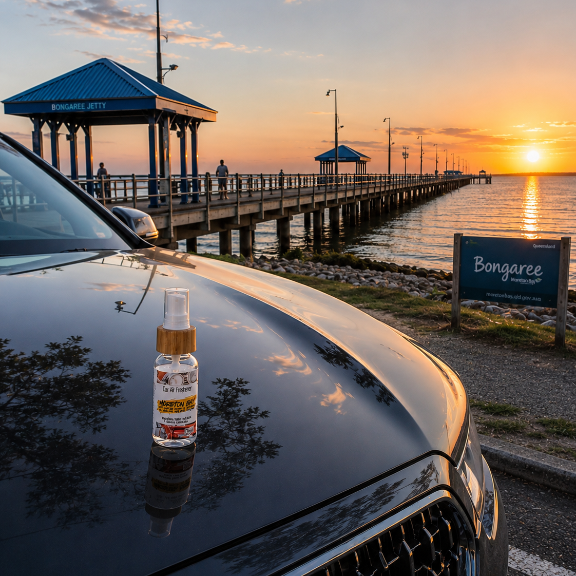 Moreton Bay Car Air Freshener sitting on the bonnet of a Black Audi parked out the front of the Bongaree Jetty in Moreton Bay.