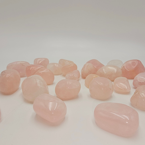 Rose Quartz Tumble Pocket Stone in colour of pink.