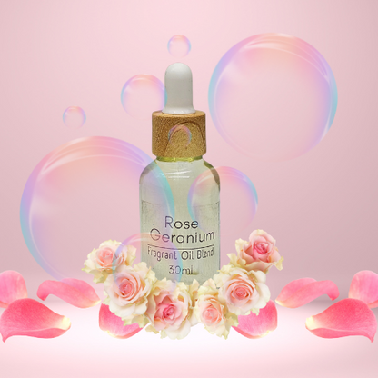 Rose Geranium fragrant diffuser oil blend bottle with flowers and bubbles on a pink background.