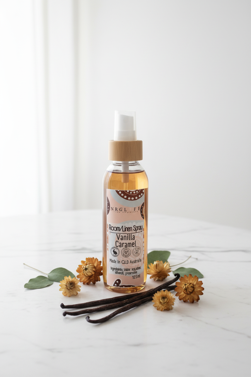 Vanilla caramel spray bottle with vanilla beans and flowers on a white background
