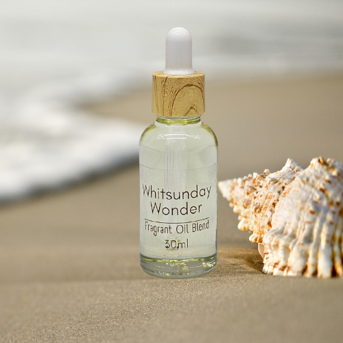 30ml Bottle of Whitsunday Wonder Fragrant Diffuser Oil Blend on sand with a shell.