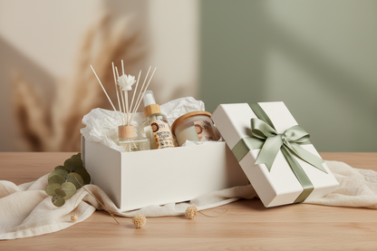 Gift basket with a diffuser, room spray and eco-candle on a wooden surface in the scent called Elysian.