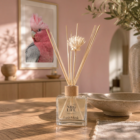 Lush Musk diffuser with pink cockatoo artwork in the background frame