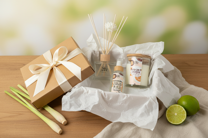 Persian Lime & Lemongrass gift box with a bow, diffuser, room spray and candle on a wooden surface with a blurred background