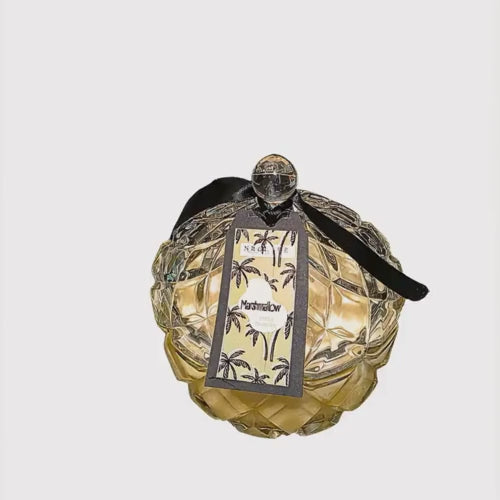 An extra large diamond shape glass candle with matching lid with marshmallow fragrance.