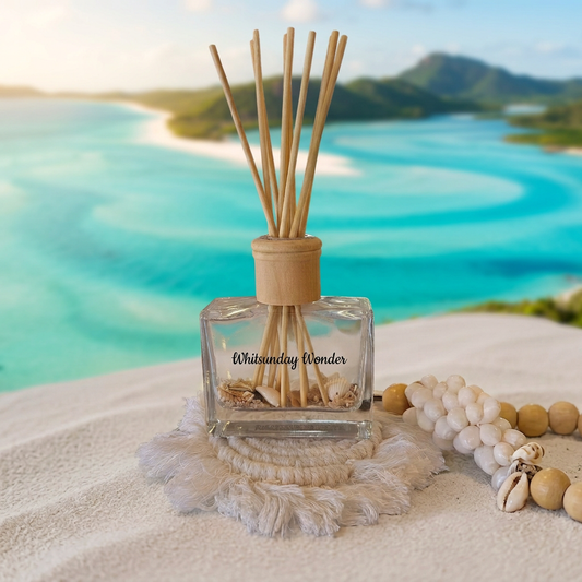 Whitsunday Wonder diffuser with a coastal background