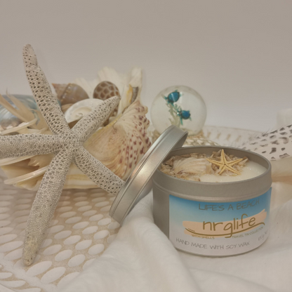 Silver Tin Candle with Perspex Lid with decorative shells on top and infused with Life's a Beach Fragrance