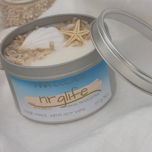 Silver Tin Candle with Perspex Lid with decorative shells on top and infused with Pina Colada Fragrance